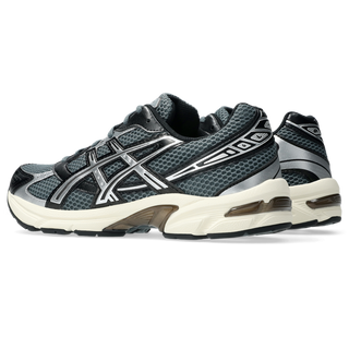 ASICS GEL-1130 sneaker in steel grey and black with mesh upper, GEL® heel cushioning, and TRUSSTIC® support system.
