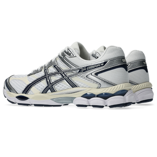 ASICS GEL-CUMULUS 16 running shoes in white and midnight colorway with synthetic leather overlays, breathable mesh, dual GEL technology cushioning, and 2010s design"