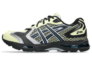 ASICS GEL-K1011 Soft Yellow/Black with layered upper and dual GEL® cushioning.