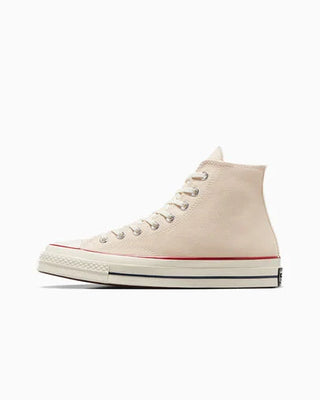 Beige high-top sneaker with white laces on a white background