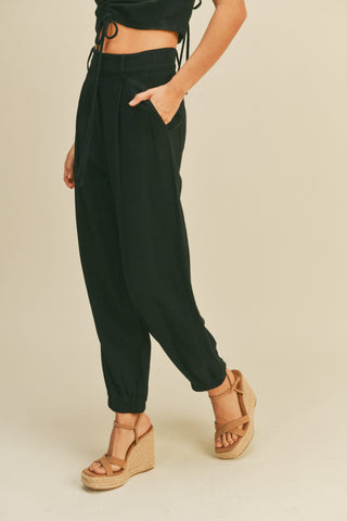 Miou Muse Black cotton linen cargo pants with band design, practical pockets.