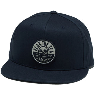 Navy Roark Fear the Sea snapback hat with deep fit, five-panel structure, heavy buckram, and iconic embroidered skull patch.