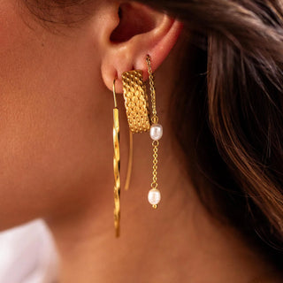 Polished gold hoop earrings with rounded classic silhouette.