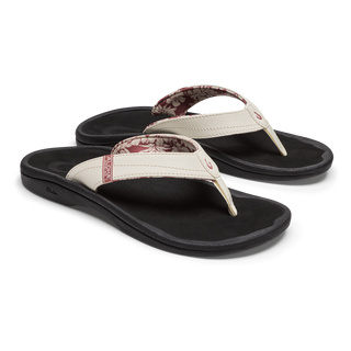 OluKai Women's 'Ohana Sandal in White Sand/Onyx — water-resistant synthetic straps, quick-drying jersey knit lining, EVA midsole with ICEVA footbed, and non-marking rubber outsole