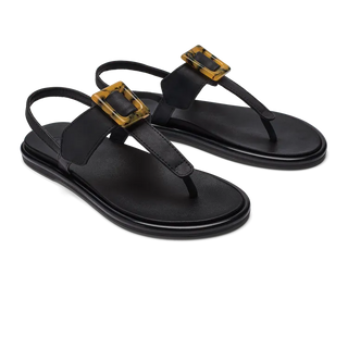OluKai La'i T-Bar Women's Sandal in Black/Black — stretchable strap, tubular toe post, tortoise shell buckle, cushioned footbed, back strap design
