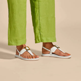 OluKai La'i T-Bar Women's Sandal in White/White — stretchable strap, tubular toe post, tortoise shell buckle, cushioned footbed, back strap design