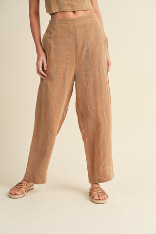 Miou Muse Straw-colored textured pants with side button details, linen-cotton-polyester blend.