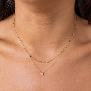 ALCO Getaway necklace in 18K gold-plated stainless steel with cubic zirconia stone, lobster clasp, and 18 inch chain.