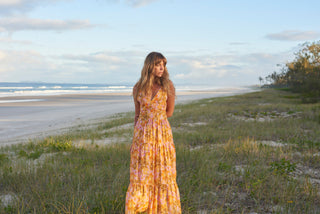 Rhythm Mahana Floral Tiered Maxi Dress in yellow, 100% Rayon, plunging neckline, elasticated back straps.