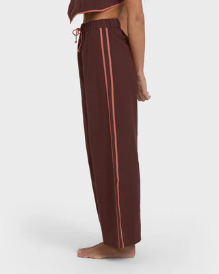 Billabong Double Take Pant in teak with elastic waist, drawcord, and contrast side binding.