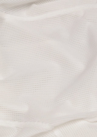 Close-up of a textured white fabric surface