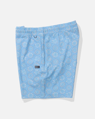 Blue patterned shorts on a white background