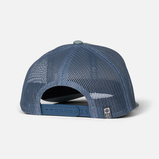 Marine and slate Salty Crew Bruce trucker hat with woven front patch, structured low-crown fit, and snapback closure.