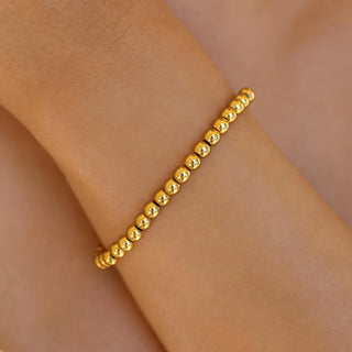 ALCO Seaside Stretch bracelet in 18K gold-plated stainless steel with comfortable stretch design for effortless coastal style.