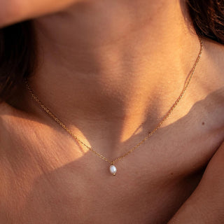 ALCO Isla necklace in 18K gold-plated stainless steel with freshwater pearl, lobster clasp, and 16 inch chain.