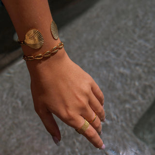 ALCO Puka Shell bracelet in 18K gold-plated stainless steel with lobster clasp, 6 inch length, and extender.