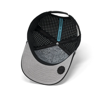 melin Odysea Rope Bulls Icon Hydro Hat in Black with a curved visor, patterned rope trim, white front logo, and perforated side panels.