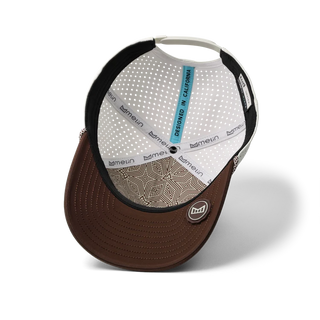 melin Odysea Rope Bulls Icon Hydro Hat in Frosted Birch with an off-white crown, brown curved visor and front logo, patterned rope trim, and perforated side panels.