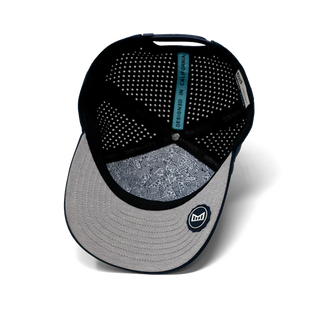 melin Odysea Rope Bulls Icon Hydro Hat in Navy — curved visor, high-crown trucker style with water-friendly, floatable HYDRO performance and moisture-wicking lining