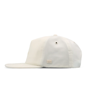  melin Eagle Hydro Hat in Egret — unstructured crushable crown, Cloud Visor Core, coated HYDRO rear panel ventilation, moisture-wicking lining, and hidden besom pocket