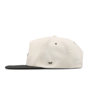 melin Eagle Hydro Hat in Moonbeam/Pirate Black — crushable unstructured crown, Cloud Visor Core, HYDRO ventilation panels, and moisture-wicking lining for travel and adventure