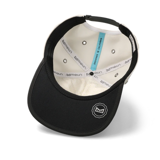 melin Eagle Hydro Hat in Moonbeam/Pirate Black — crushable unstructured crown, Cloud Visor Core, HYDRO ventilation panels, and moisture-wicking lining for travel and adventure