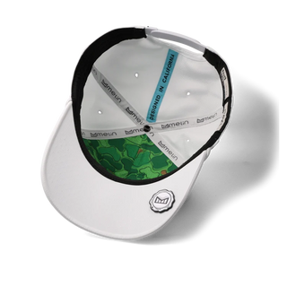melin Odysea Rope Links Hydro Hat in White with perforated front panels, a small melin logo, rope trim, and a curved visor.