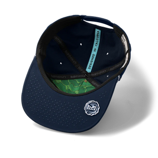 melin Coronado Links Hydro Hat in Navy — MagnaLink ball marker, 4-Way Stretch, Microperf panels, water repellent, antimicrobial, moisture-wicking, built for the golf course