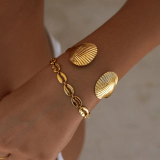 ALCO Puka Shell bracelet in 18K gold-plated stainless steel with lobster clasp, 6 inch length, and extender.