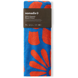 Nomadix Organic Cotton Beach Towel in Big Flowers Stellar Orange — plush, absorbent, Fair Trade Certified™, 100% organic cotton, 30" x 72.5"