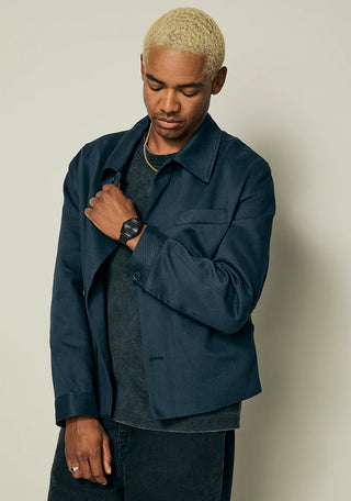 Nixon Time Teller All Black analog watch with stainless steel bracelet and minimalist black dial.