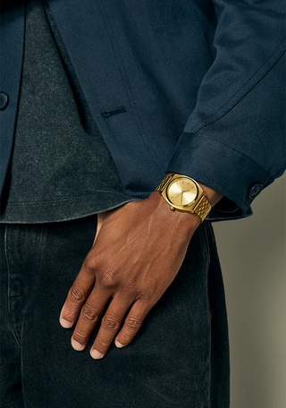 Nixon Time Teller All Gold analog watch with gold stainless steel bracelet and matching minimalist dial.