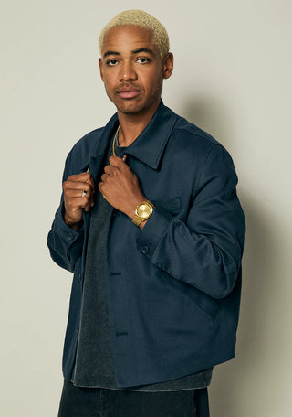 Nixon Time Teller All Gold analog watch with gold stainless steel bracelet and matching minimalist dial.
