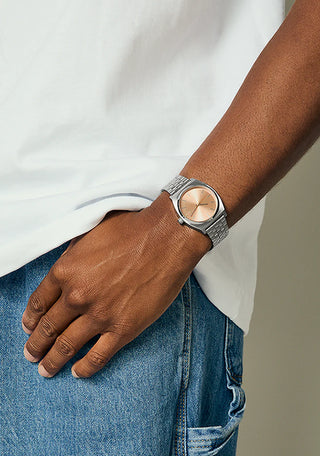 Nixon Time Teller Silver/Coral analog watch with stainless steel bracelet and vibrant coral dial.
