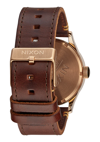 Nixon Sentry Leather Rose Gold/Gunmetal/Brown watch with brown leather strap and gunmetal analog dial.