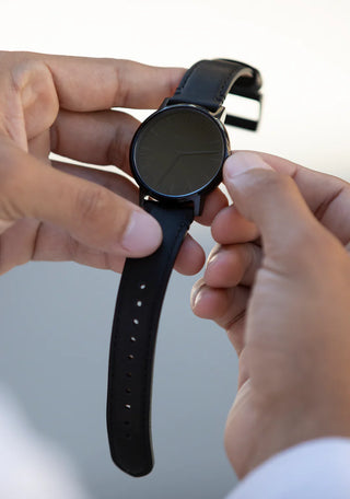 Nixon Porter Leather All Black analog watch with black leather strap and minimalist black dial.