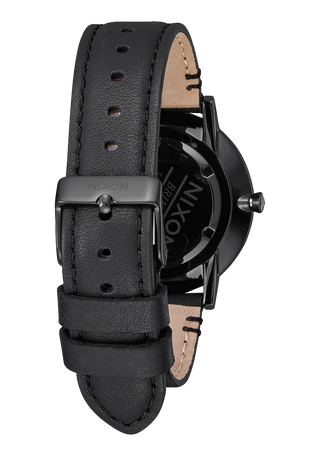 Nixon Porter Leather All Black/Gold analog watch with black leather strap and gold-accented black dial.