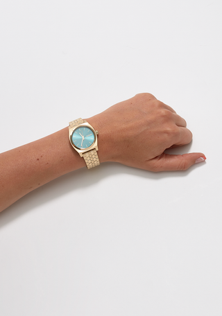 Image of Nixon Medium Time Teller Light Gold and Turquoise Watch, a stylish and elegant wristwatch with a turquoise dial and stainless steel bracelet.