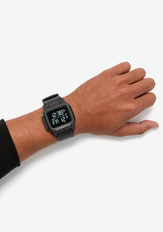 Nixon Regulus All Black digital watch with high-contrast LCD display and black TPU strap.