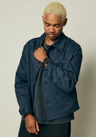 Nixon Staple All Black digital watch with recycled plastic case, high-contrast LCD, and black rubber-blend strap.
