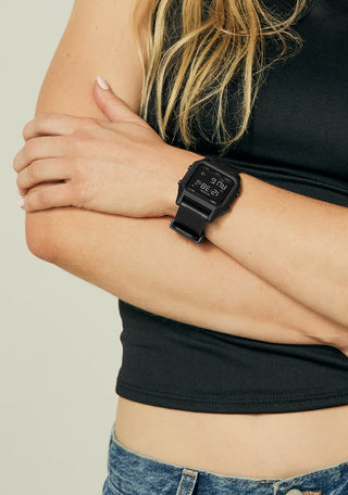 Nixon Staple All Black digital watch with recycled plastic case, high-contrast LCD, and black rubber-blend strap.