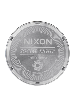 Image of the Nixon Optimist Silver and Gold Watch, a fashionable and sustainable wristwatch with a distinctive solar panel and polished design.