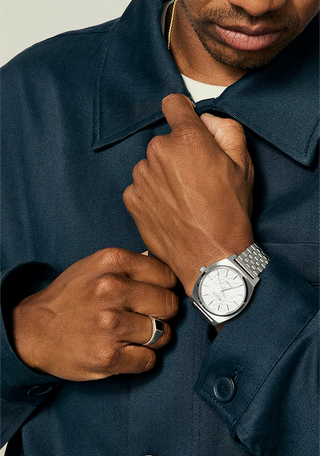 Nixon Time Teller Solar Watch in Silver/Snow — 40.5mm stainless steel case with solar-powered Miyota movement, hardened mineral crystal, quick-release 5-link bracelet, and 10 ATM water resistance