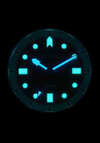 Nixon Stinger 44 Watch in Silver/Black/White with luminous display and stainless steel bracelet.