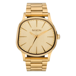 Nixon Sentry Wobble Watch in All Gold — 42mm stainless steel case with unique bent wobble design, Miyota quartz movement, hardened mineral crystal, lume hands, and quick-release bracelet