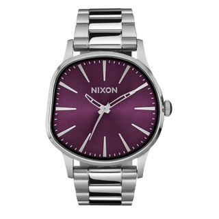 Nixon Sentry Wobble Watch in Silver/Purple Sunray — 42mm stainless steel case with unique bent wobble design, Miyota quartz movement, hardened mineral crystal, lume hands, and quick-release bracelet