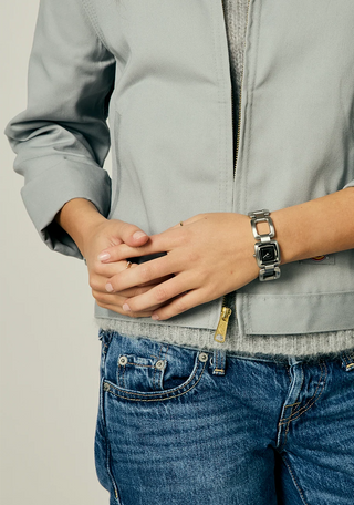 Nixon Sisi Watch in All Silver/Black — 24mm stainless steel case with linked bracelet, tool-free extra link adjustment, Miyota quartz movement, and 100-meter water resistance