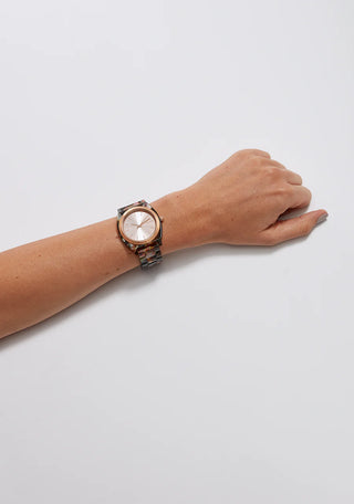 A stylish image of the Nixon Time Teller Acetate Tortoise watch, showcasing its elegant tortoise acetate finish.