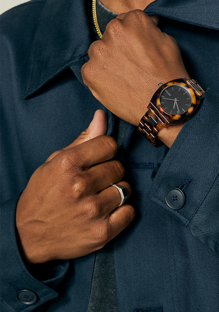 Nixon Time Teller Acetate Tortoise watch with handcrafted acetate bracelet and minimalist analog dial.