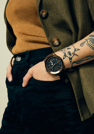 Nixon Corporal Chocolate/Dark Roast analog watch with stainless steel bracelet and rugged brown field-style dial.